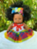 Poupée Madras artisanale Flamme des Îles – robe madras rouge, jaune, bleu et vert