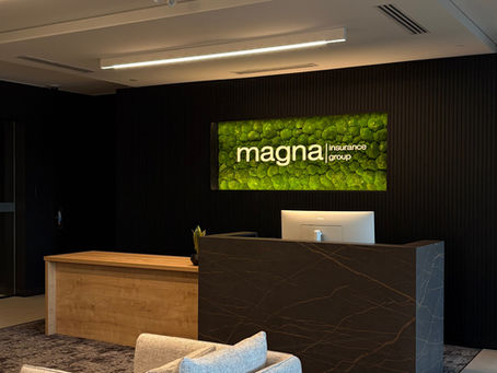 Moss wall built in office lobby wall behind reception area