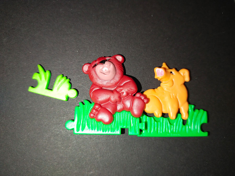Miniatura: Medvídek a štěně na zelené trávě