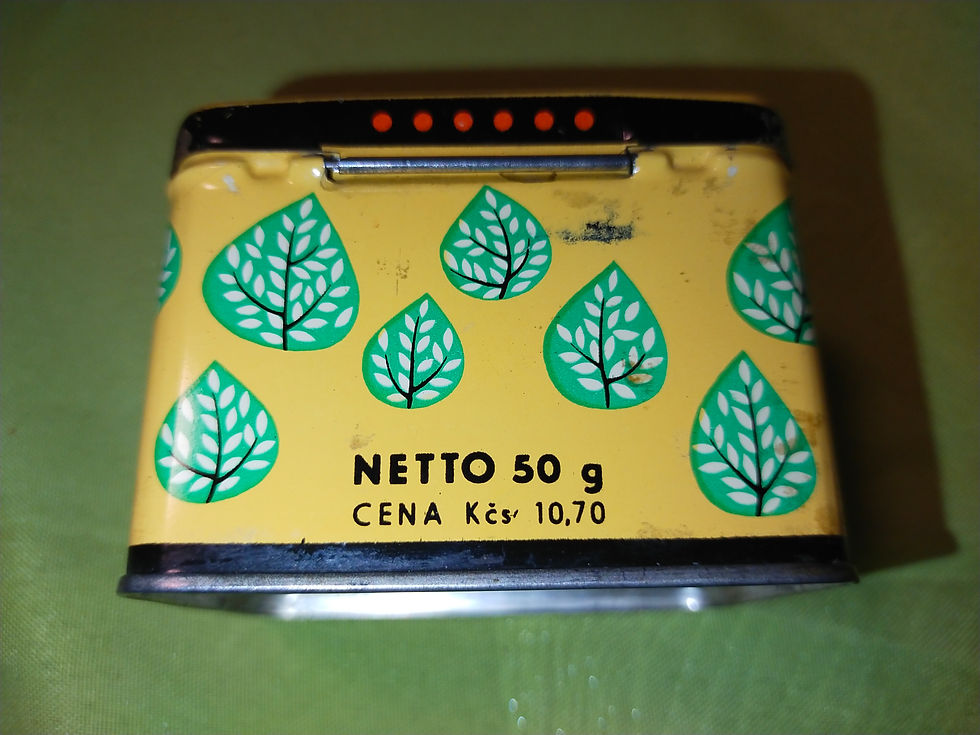 Žlutá plechová krabička s motivem listů, NETTO 50 g, CENA Kčs 10,70