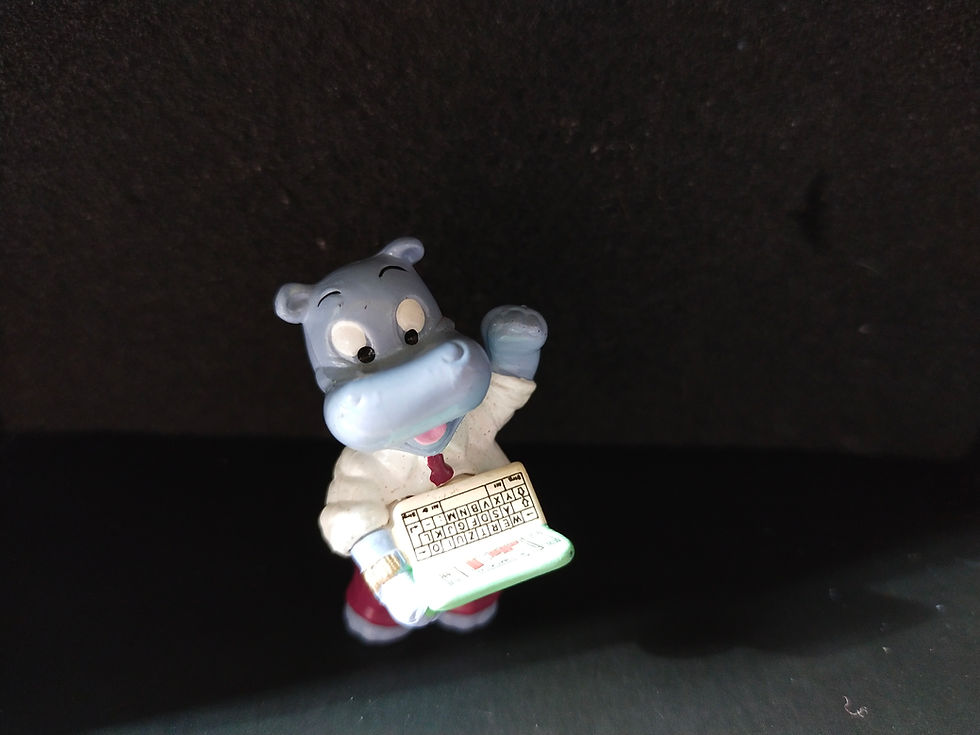 Roztomilá figurka hrocha s knihou