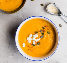 Nourishing bowl of soup on a table - a reminder that small, supportive meals can help during cancer treatment.
