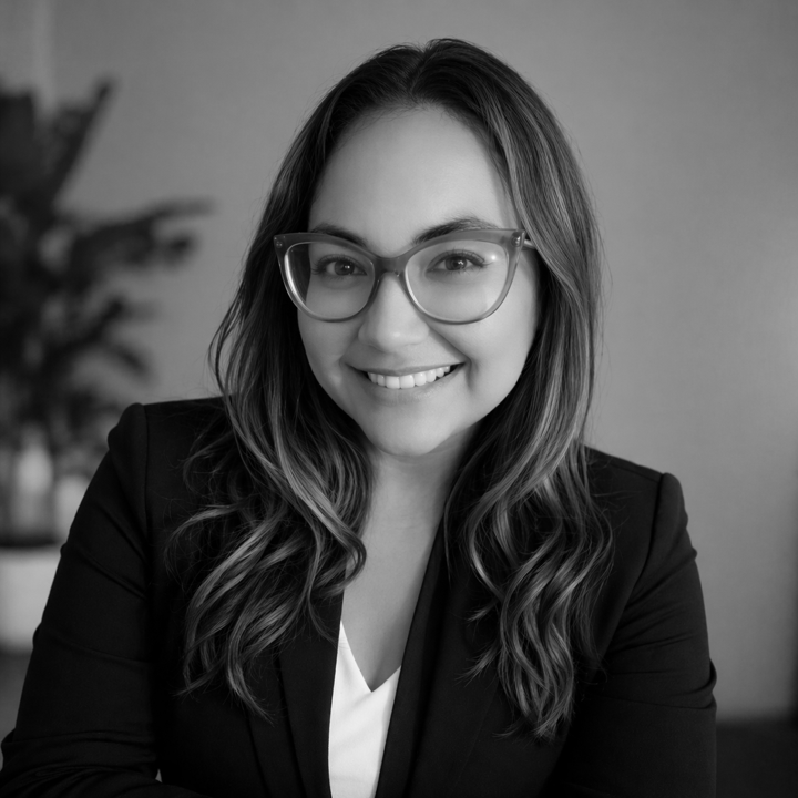 Professional headshot in warm office setting bw.png