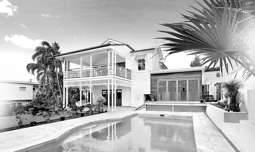 beach house with pool out front, black and white photo
