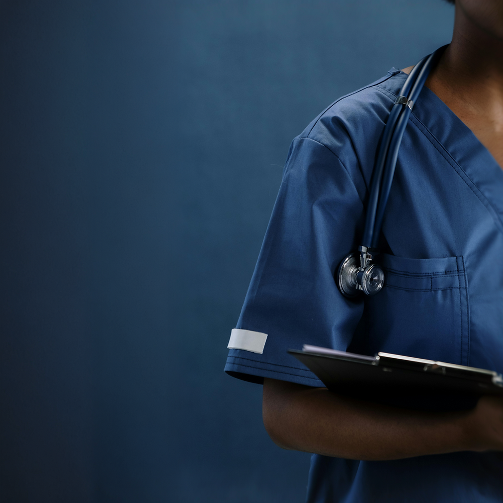 Medical professional in scrubs with stethoscope and clipboard