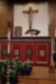 The crucifix hanging behind the altar at Trinity Communion Church.