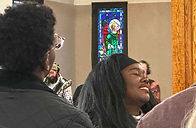 Women worshiping during Sunday service