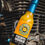 Thumbnail: Pineapple Habanero Hot Sauce in front of a motorcycle engine