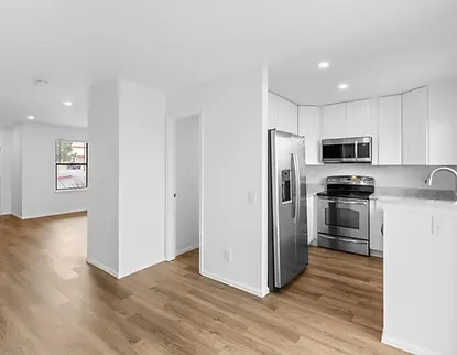 after photo of our renovation showing a NorthGlenn living room and kitchen
