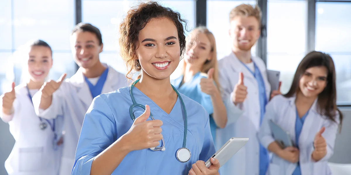 nurses-smiling-with-thumbs-up-1200x600-1.webp