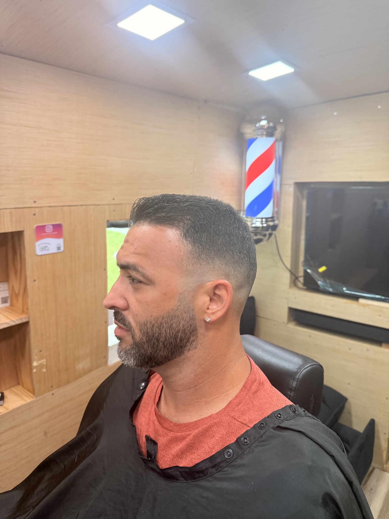 Fade and beard trim on a client inside the mobile barbershop
