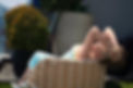 BustyGina arching backward over a chair with both hands in her hair