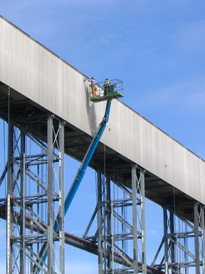 Sky Rise Metal Panels 
Men working at height 