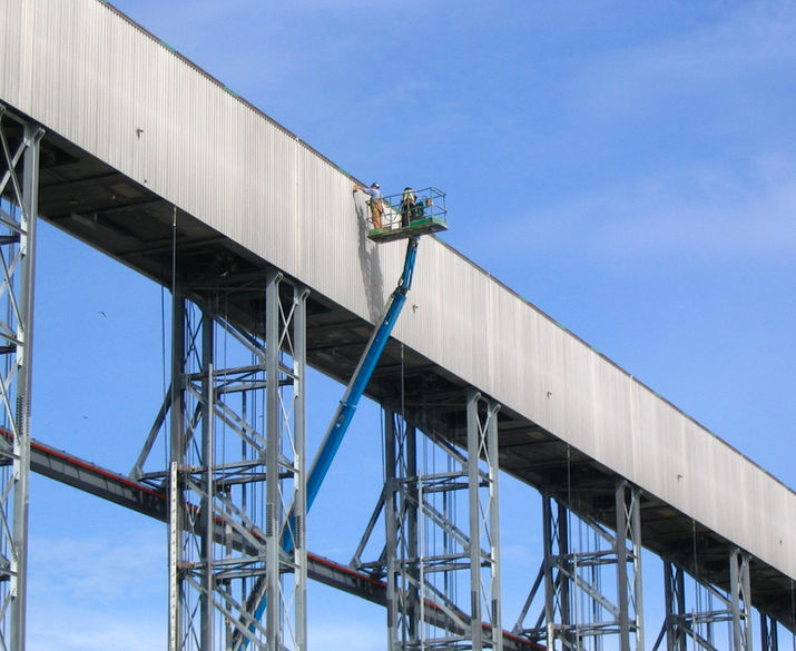 Sky Rise Metal Panels 
Men working at height 