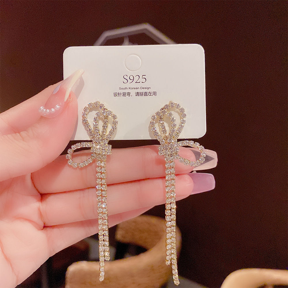 Bow Tassel Earrings with Full Diamond Glass Detailing