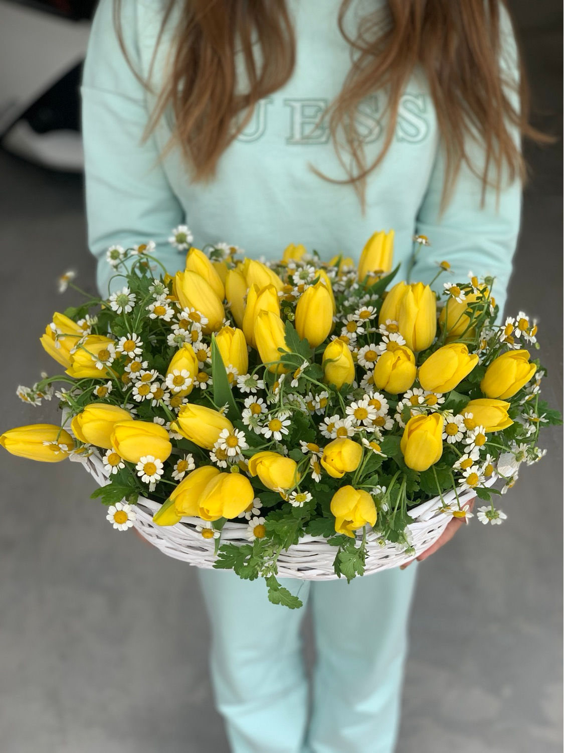 Yellow tulips in wicker basket large