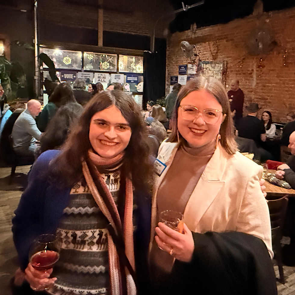 Alex and a friend post at a fundraiser event