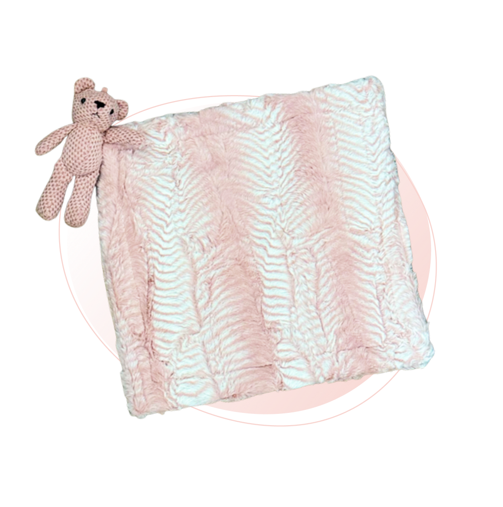 A Boa Rose Lovie Blanket with a small bear plush.