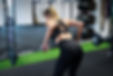 Woman performing a barbell bent over row with proper form