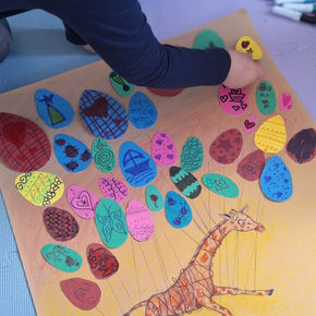 Child participating in a colorful art activity at the Nissimou children’s therapy center in Spetses.
