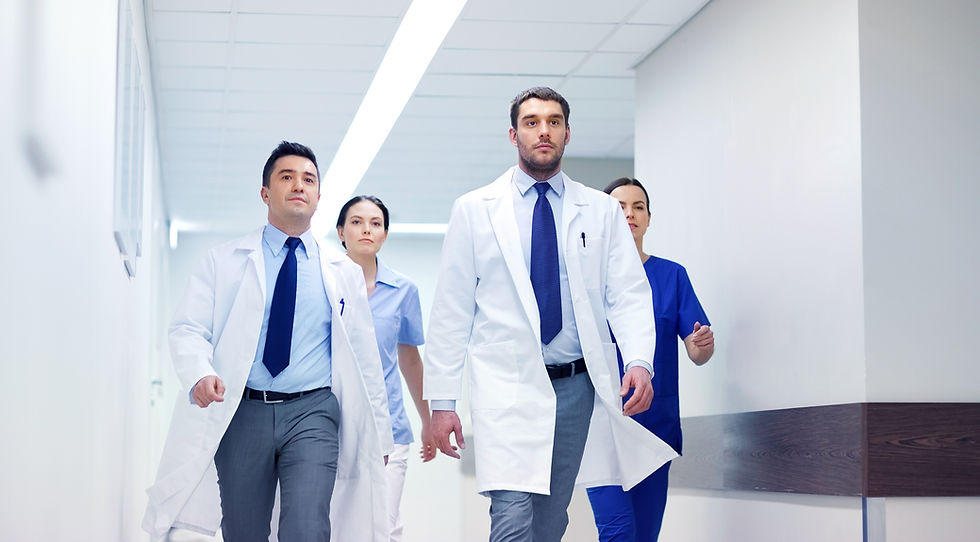 group-of-medics-walking-along-hospital-P