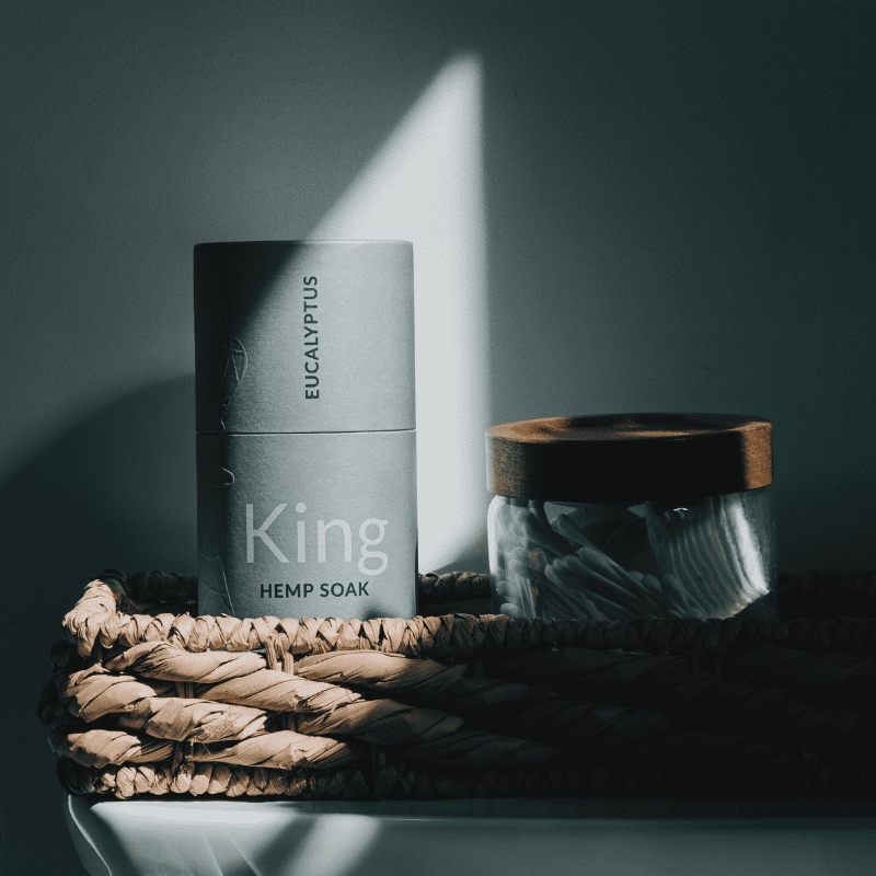 The king soak atop a vanity in a shadowy light.