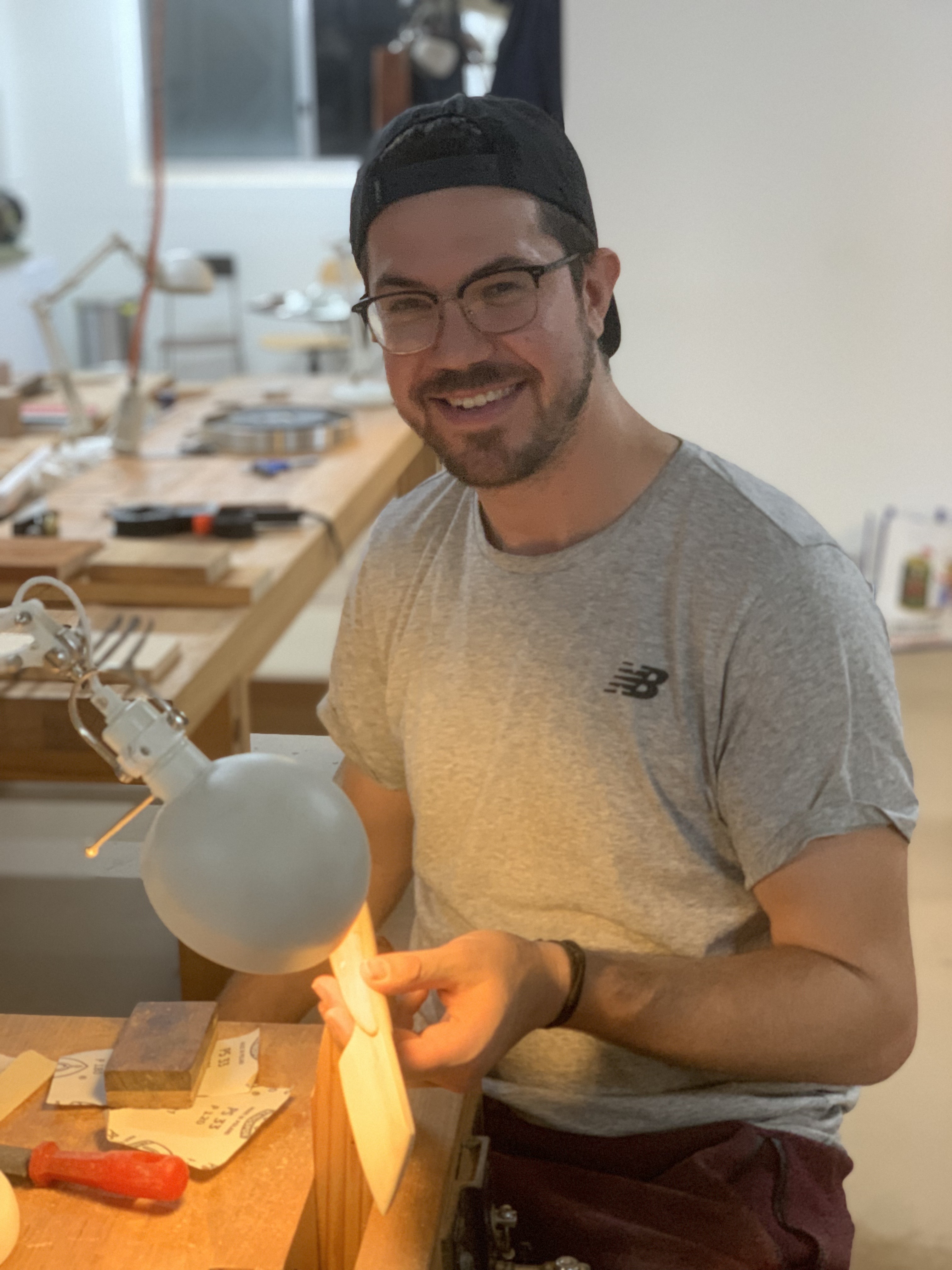 A Chisel & Dowel student shaping the cheese knife project during a woodworking class in Sydney.