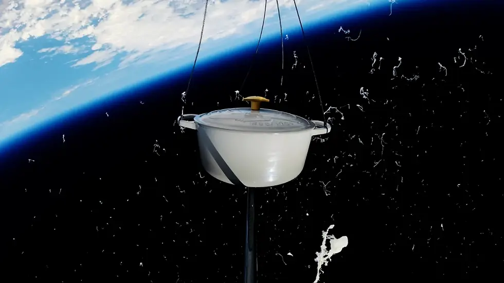 A Le Creuset x Star Trek Casserole floating in space with Earth's horizon in the background
