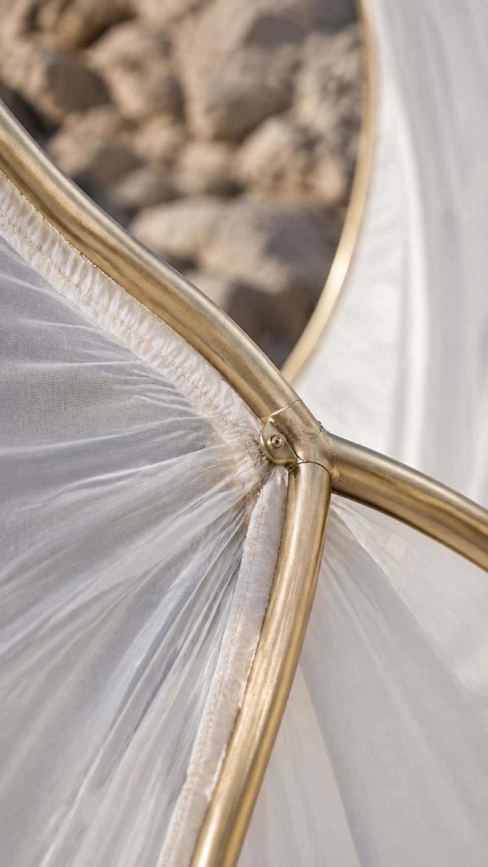 Gold-edged translucent fabric detail from the sculptural wedding installation