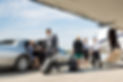 Business partners about to board private jet while airhostess and pilot greeting them.jpg
