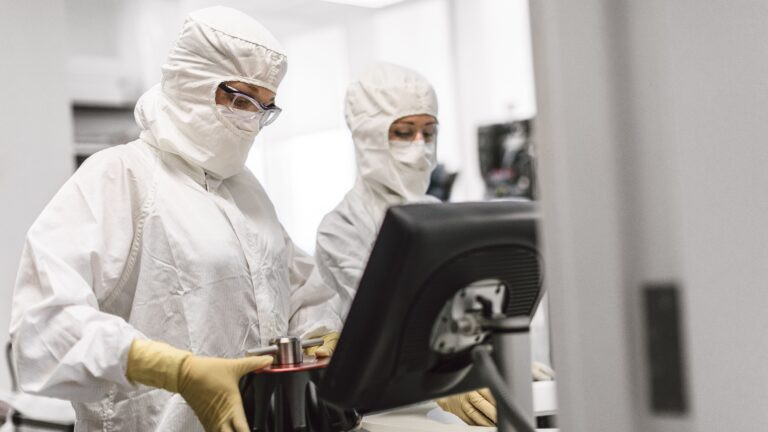 Spark Therapeutics manufacturing associates preparing to purify Luxturna at the company's manufacturing facility in West Philadelphia, Pennsylvania.
