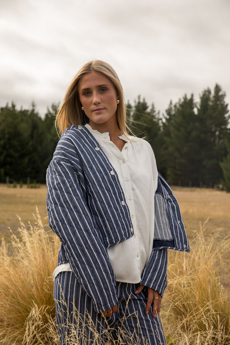Gifted lifestyle apparel photo showing a striped scarf and white shirt in Wānaka.