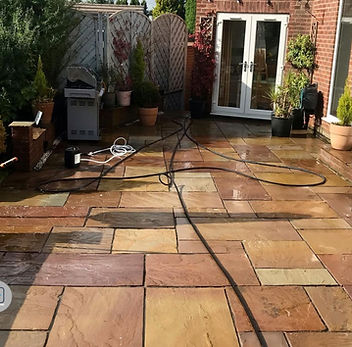 clean indian sandstone patio after pressure washing by hydra restore