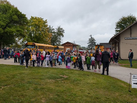 Children gather excitedly at Old Falls Village Historical Park for the "In Touch With History" program, hosted by the Menomonee Falls Historical Society.