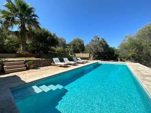 Swimming pool with sunbeds