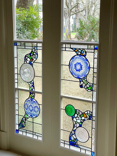clients beach glass window in entry to hode air con units.jpg