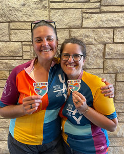 Two SuperStars show off their Ride for Youth Stickers