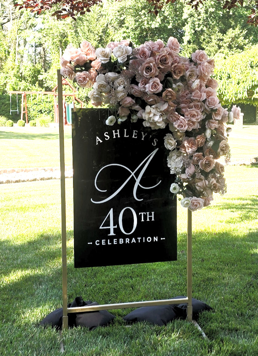 Custom acrylic sign on stand with floral