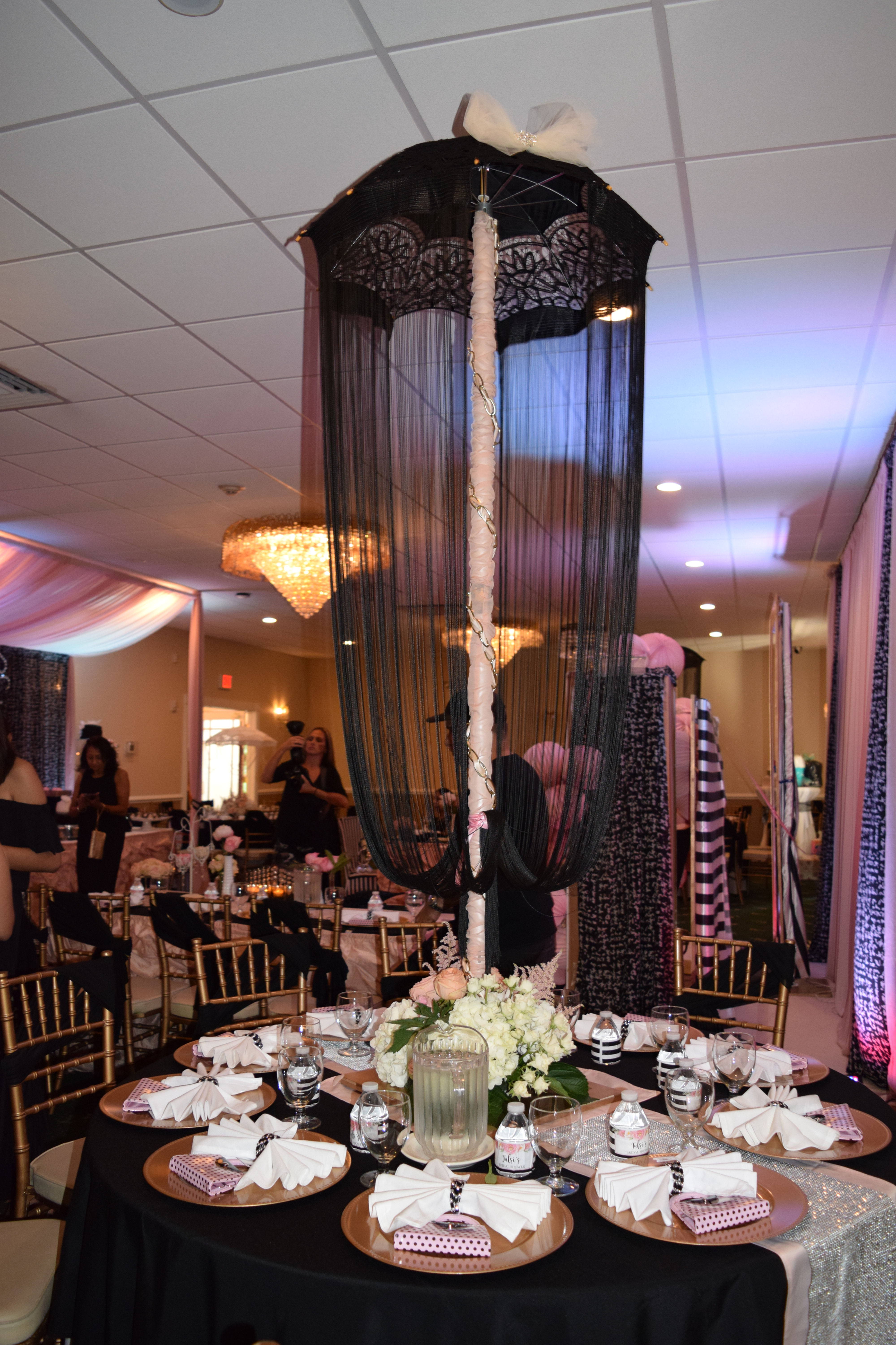 Black lace umbrella on stand with fringe