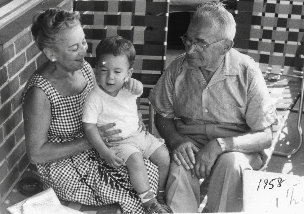 David Hochman (future '74) with his maternal grandparents, Sarah and Abraham Bell at 577 Grand Street in 1958