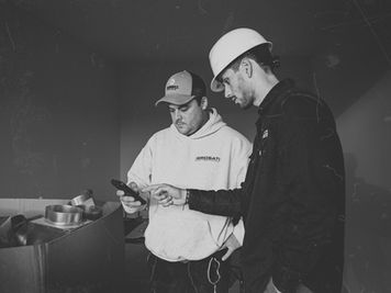 A SCELTA software engineer Boots on the Ground with an HVAC technician.