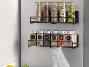 Small organized kitchen with space-saving storage containers, under sink organizer, and magnetic spice rack.