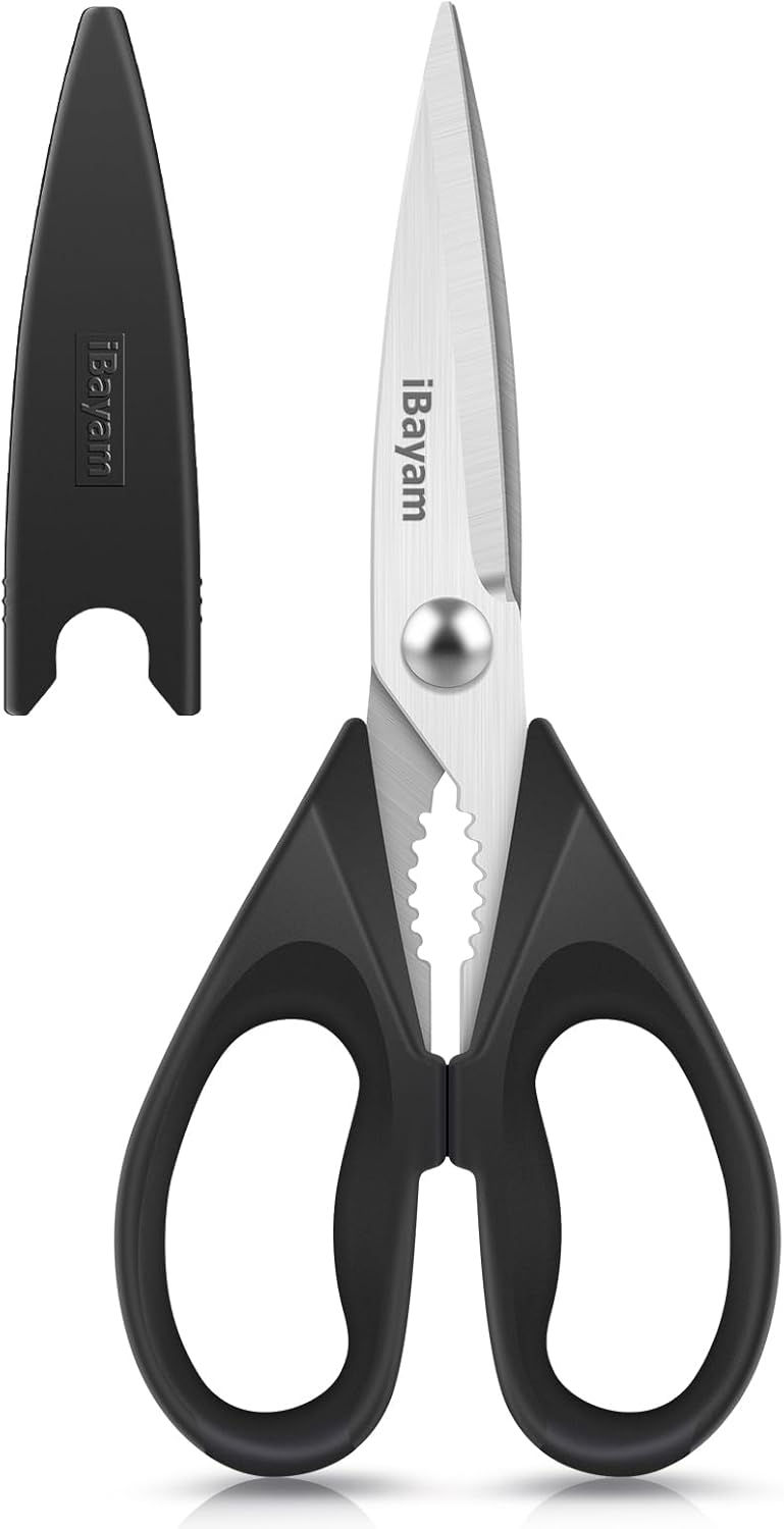 Kitchen scissors with black and red handles for everyday food preparation and kitchen tasks.