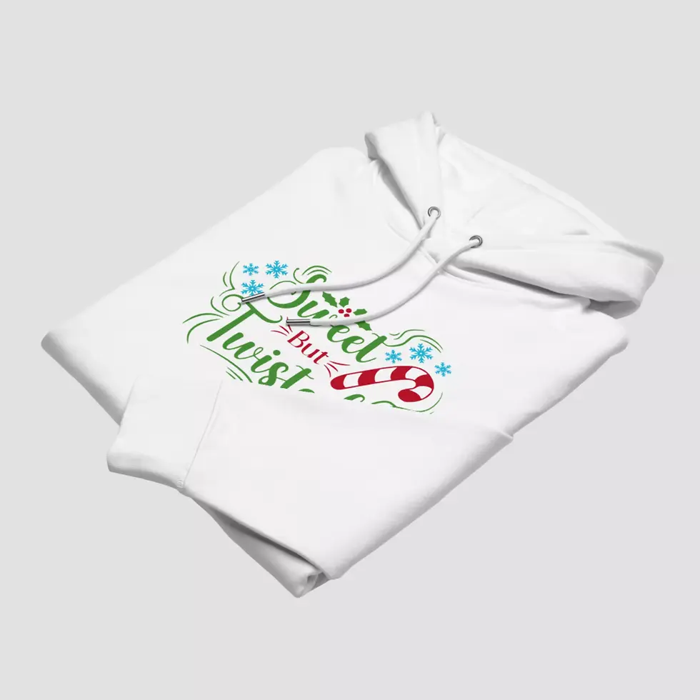 Miniature : Sweat à capuche candy cane Noël bio. Haut blanc plié pour voir la qualité du design et du tissu en coton bio respirant.
