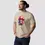 Miniature : T-shirt champignon magic unisexe. Haut de couleur sable arboré par un mannequin homme. Imprimé sur un coton bio ultra doux.