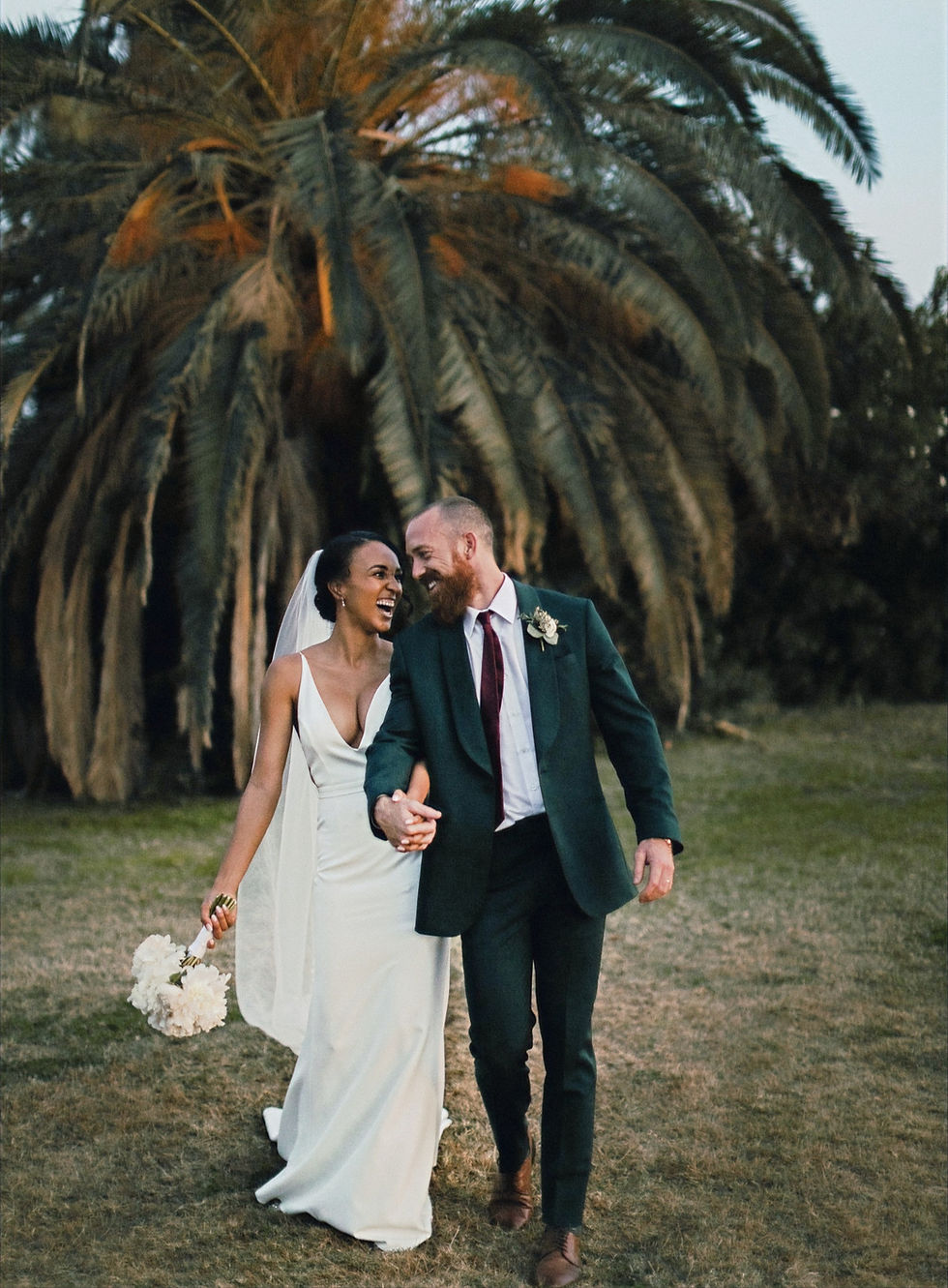 happy couple palm trees