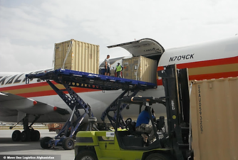 Move One loading shipping containers onto the side of a plane with a scissor lift.