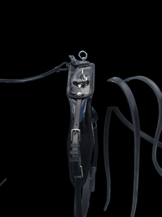 Shaped fully padded driving saddle with patent leather and silver ornaments and hardware on black background