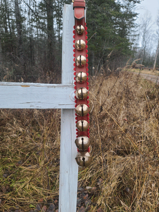 chestnut leather neck neckstrap with brass bells and pinked wool felt border