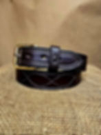 1.5" wide men's leather belt in rich dark brown bridle leather with figure 8 stitching and a square brass roller buckle shown on a brown burlap background.
